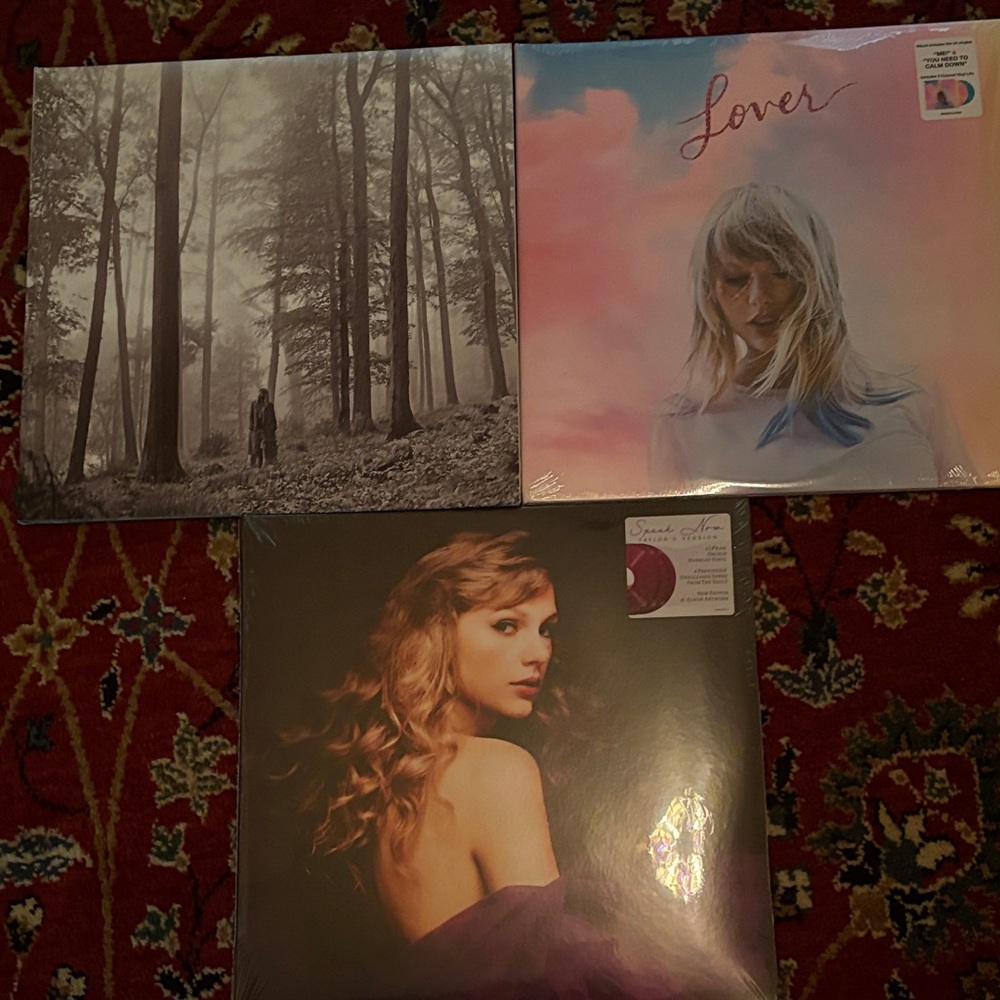 Taylor Swift Album Trio with Black, Pink, and Brown Covers